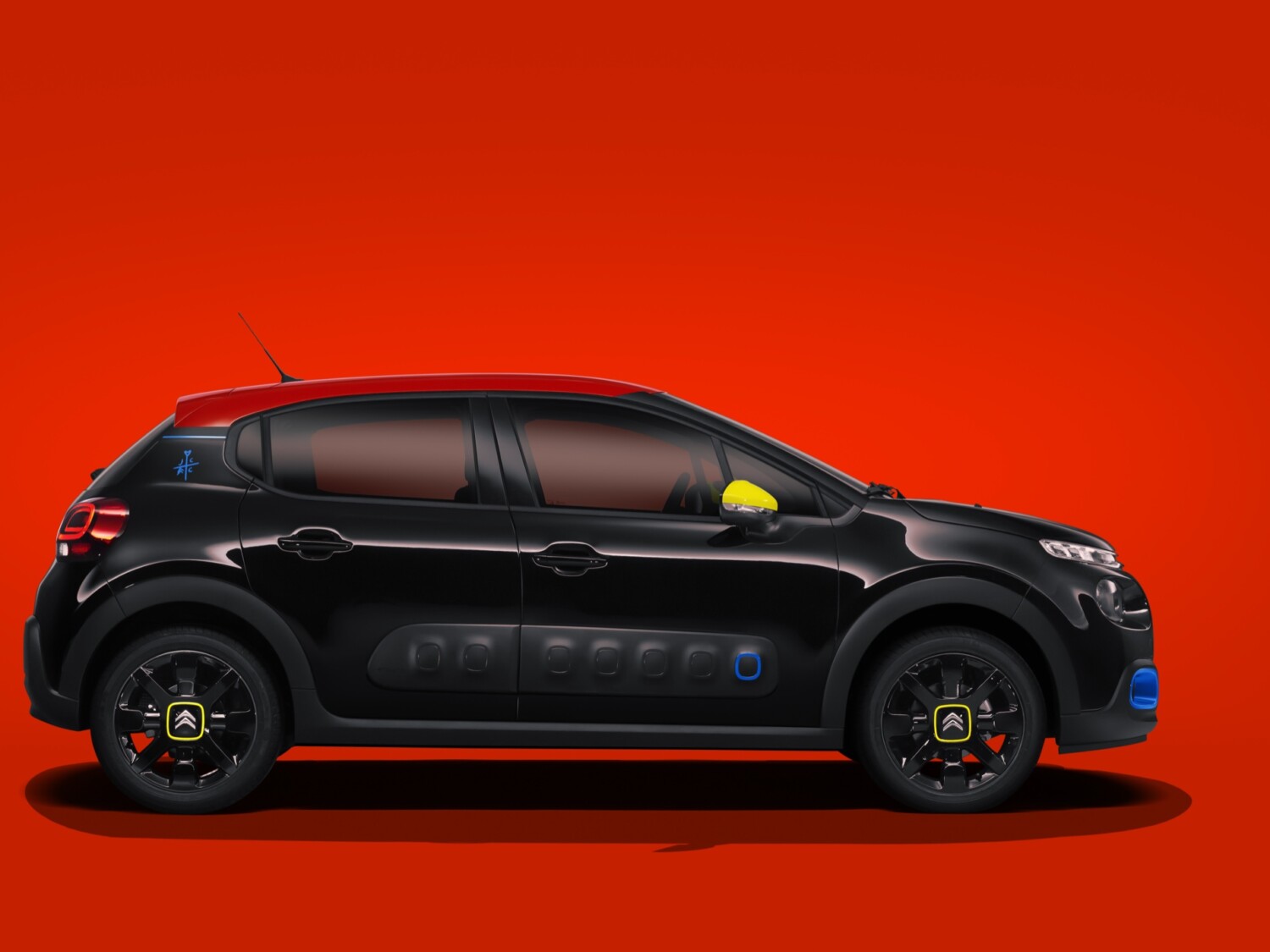 Citroën C3 JCC+ by Jean-Charles de Castelbajac — side profile on a red background